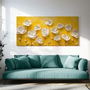 Yellow spring flower print with textured white blooms hanging above a sofa
